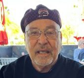 Ed Vivio wearing glasses and a beret.
