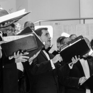 Members of the Orpheus Male Chorus of Phoenix singing together during a performance.