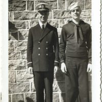 Ted Crow in military uniform standing with another serviceman.